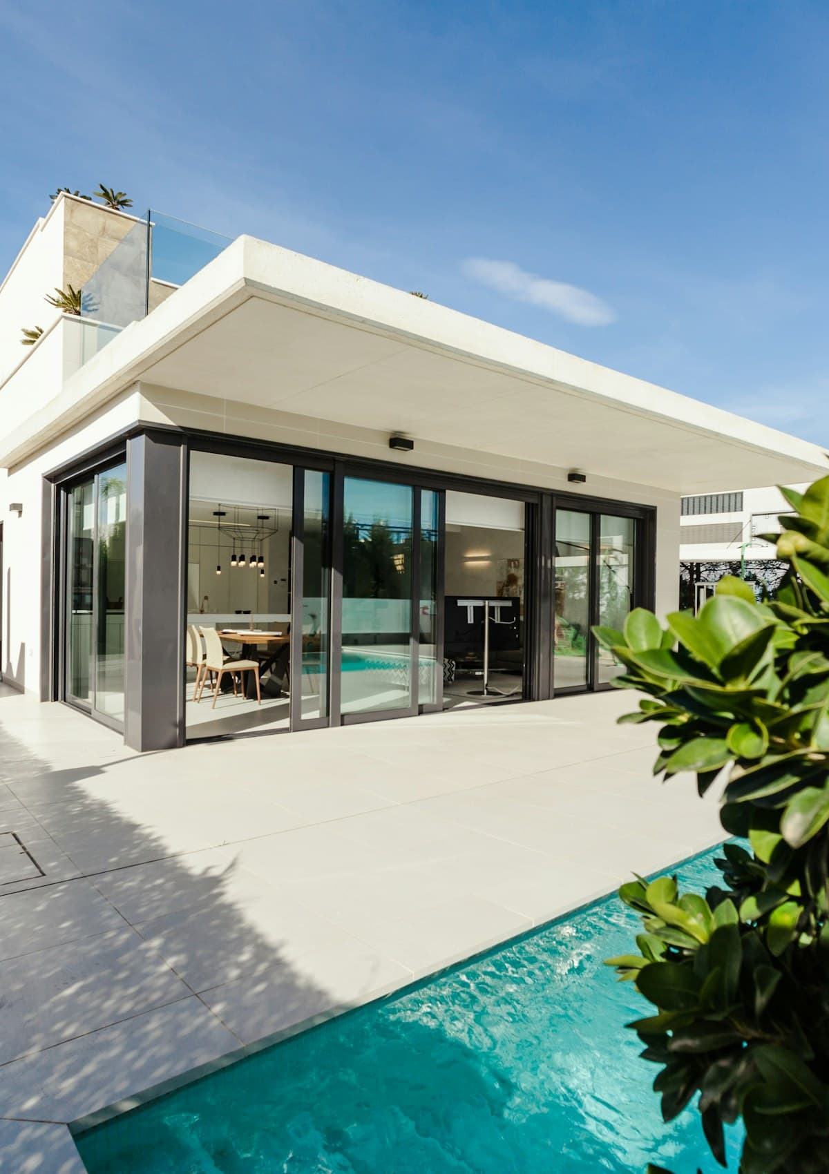 Modern white villa beside a pool